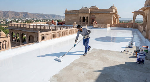 Engineer inspecting a waterproofing membrane installation